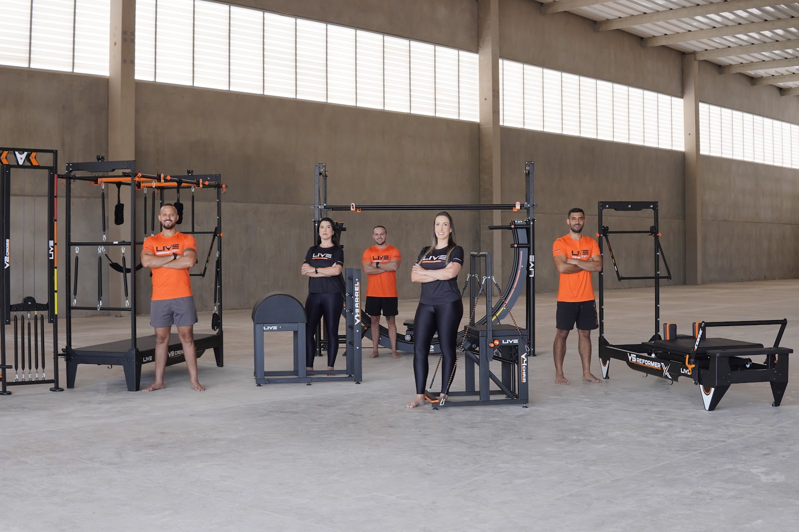 Live professional Pilates equipment lineup: reformers, cadillac, chair and barrels