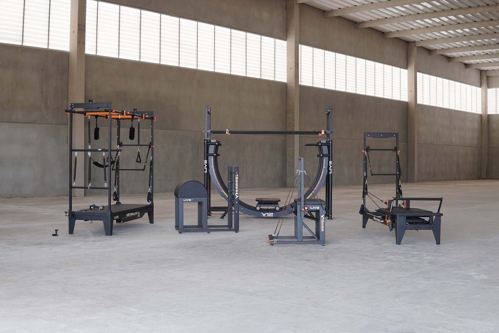 Live equipped Pilates studio: reformers and apparatus arranged for group classes